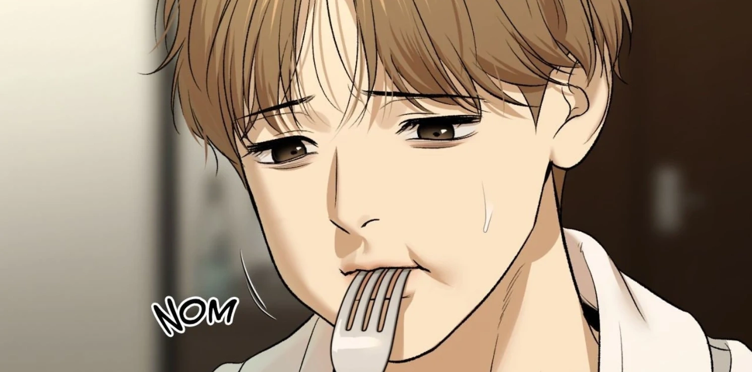 Dan eating with a worried expression in Jinx Chapter 85, showing his emotional tension and inner struggle.